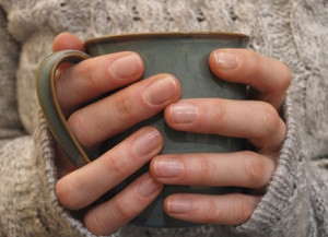 holding a mug of tea